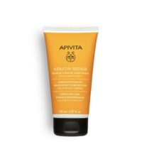 Bottle  of  Apivita  Nourishing  Conditioner  and  Repair,  a  creamy  conditioner  indicated  for  repairing  damaged  hair  fiber.
