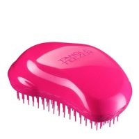 Product  container  of  The  Original  Detangler  by  Tangle  Teezer,  a  hair  brush  indicated  for  removing  knots  without  breakage.