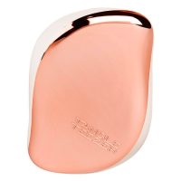 Product  container  of  Tangle  Teezer  Compact  Styler  by  Tangle  Teezer,  a  hairbrush  indicated  for  detangling  hair  knots.