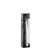 Product  container  of  Curaprox  Black  Is  White  Toothbrush  Duo  by  Curaprox,  a  soft  toothbrush  indicated  for  plaque  removal.