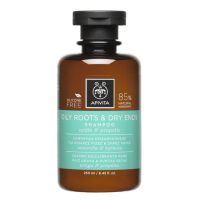 Bottle  of  Apivita  Oily  Roots  and  Dry  Ends  Shampoo  by  Apivita,  a  shampoo  indicated  for  balancing  and  repairing  hair.