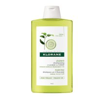 Bottle  of  Klorane  Shampoo  With  Citrus  Pulp  by  Klorane,  a  shampoo  indicated  for  regulating  sebum  production  in  normal  to  oily  hair.