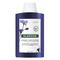 Bottle  of  Anti-Yellowing  Shampoo  With  Centaury  by  Klorane,  a  shampoo  indicated  for  enhancing  the  silver  tone  of  gray  or  white  hair.