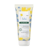 Bottle  of  Klorane  Baby  Detangling  Shampoo  by  Klorane,  a  mild  shampoo  indicated  for  sensitive  baby  hair  and  scalp.