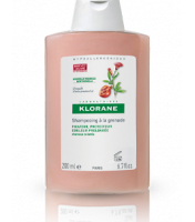 Bottle  of  Klorane  Pomegranate  Shampoo  by  Klorane,  a  shampoo  indicated  for  protecting  and  fixing  the  color  of  colored  hair.