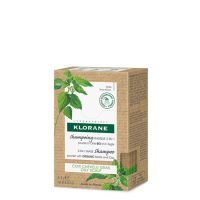 Sachet  of  Klorane  2-in-1  Mask  Shampoo  by  Klorane,  a  powdered  shampoo-mask  indicated  for  oily  scalp  and  sebum  control.