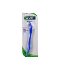 Product  container  of  GUM  Denture  Brush  201  by  GUM,  a  specialized  toothbrush  indicated  for  the  daily  hygiene  of  dentures.