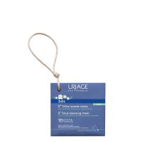 Product  container  of  Uriage  Baby  Solid  Cleansing  Cream  by  Uriage,  a  solid  soap-like  cream  indicated  for  delicate  baby  skin.