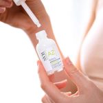 a fluid concentrate indicated for reducing skin imperfections and redness.
