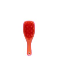 Product  container  of  Tangle  Teezer  Mini  Wet  Detangler  by  Tangle  Teezer,  a  travel  brush  indicated  for  detangling  wet  hair.