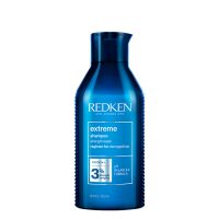 Bottle  of  Redken  Extreme  Strength  Repair  Shampoo  by  Redken,  a  shampoo  indicated  for  cleansing  and  repairing  damaged  hair.