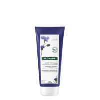Bottle  of  Centaury  Conditioner  by  Klorane,  a  balm  conditioner  indicated  for  neutralizing  yellow  tones  in  gray  hair.