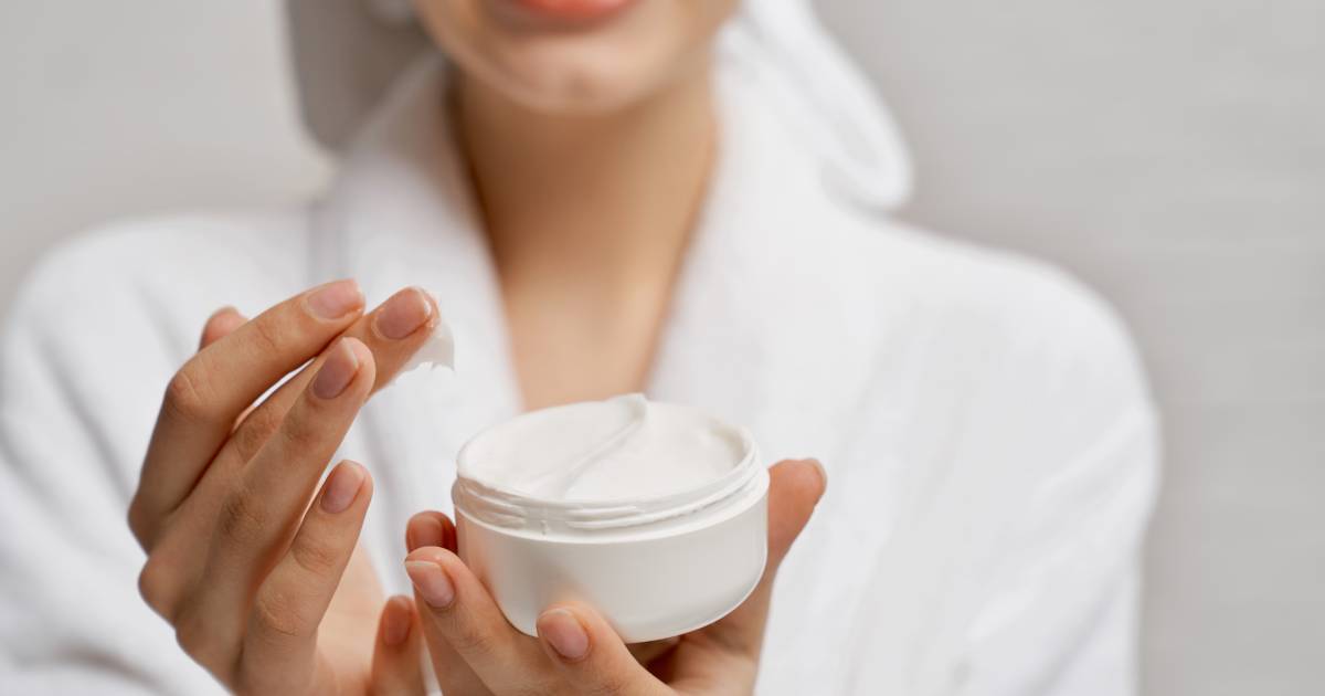 Woman applying skincare with ceramides