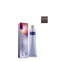 Product  container  of  Illumina  Color  Permanent  Color  by  Wella  Professionals,  a  cream  color  indicated  for  100%  white  hair  coverage.