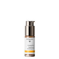 Product  container  of  Dr.  Hauschka  Translucent  Bronzing  Tint,  a  fluid  tint  indicated  for  a  natural  bronzed  look.