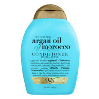 Bottle  of  Ogx  Argan  Oil  Renewing  Hair  Conditioner  by  Ogx,  a  conditioner  indicated  for  moisturizing  and  strengthening  hair.