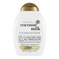Bottle  of  Ogx  Coconut  Milk  Conditioner  by  Ogx,  a  conditioner  indicated  for  hydrating  and  repairing  damaged  hair.