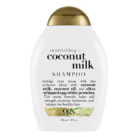 Bottle  of  Ogx  Coconut  Milk  Shampoo  by  Ogx,  a  shampoo  indicated  for  moisturizing  hair  and  providing  shine.