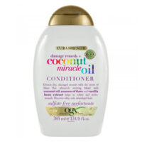 Bottle  of  Ogx  Coconut  Miracle  Oil  Conditioner  by  Ogx,  a  conditioner  indicated  for  repairing  dry  and  coarse  hair.