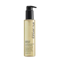 Jar  of  Essence  Absolue  Universal  Hair  &  Skin  Balm  by  Shu  Uemura,  a  balm  indicated  for  hydrating  dry  areas  of  the  body  and  hair.