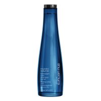 Bottle  of  Muroto  Volume  Lightweight  Care  Shampoo  by  Shu  Uemura,  a  volumizing  shampoo  indicated  for  adding  body  to  fine  hair.