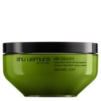 Jar  of  Silk  Bloom  Restorative  Mask  by  Shu  Uemura,  a  nourishing  mask  indicated  for  repairing  and  strengthening  damaged  hair.