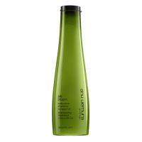 Bottle  of  Silk  Bloom  Shampoo  by  Shu  Uemura,  a  repairing  shampoo  indicated  for  frizzy  or  damaged  hair.