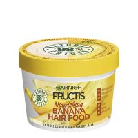Jar  of  Garnier  Fructis  Hair  Food  Banana  Ultra-Nourishing  Mask  by  Garnier,  a  3-in-1  mask  indicated  for  nourishing  and  moisturizing  dry  hair.