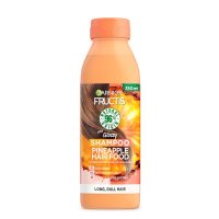 Bottle  of  Garnier  Fructis  Hair  Food  Pineapple  Shampoo  by  Garnier,  a  shampoo  indicated  for  strengthening  and  protecting  fragile  hair.