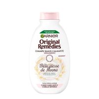 Bottle  of  Garnier  Original  Remedies  Oat  Délicatesse  Shampoo  by  Garnier,  a  shampoo  indicated  for  sensitive  scalp  and  hair.