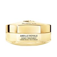 Jar  of  Guerlain  Abeille  Royale  Rich  Day  Cream  by  Guerlain,  a  balm-like  cream  indicated  for  firming  and  illuminating  the  complexion.