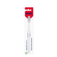 Product  container  of  Kin  Gums  Toothbrush  by  Kin,  a  manual  toothbrush  indicated  for  massaging  teeth  and  gums  to  improve  circulation.
