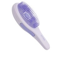 Product  container  of  Beter  Deslía  Pop  Up  Hair  Brush  by  Beter,  a  retractable  brush  indicated  for  untangling  dry  or  wet  hair.