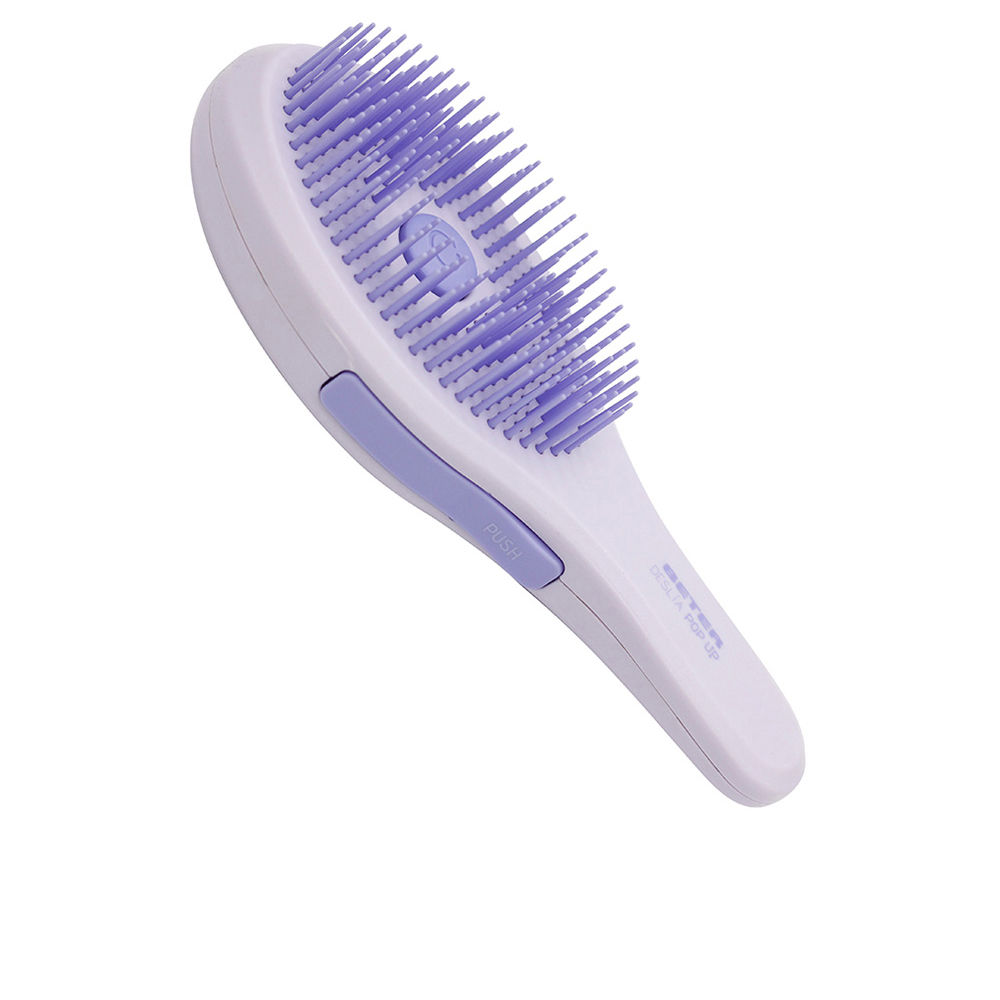 BeterDeslíaPopUpHairBrush Product container of Beter Deslía Pop Up Hair Brush by Beter, a retractable brush indicated for untangling dry or wet hair.