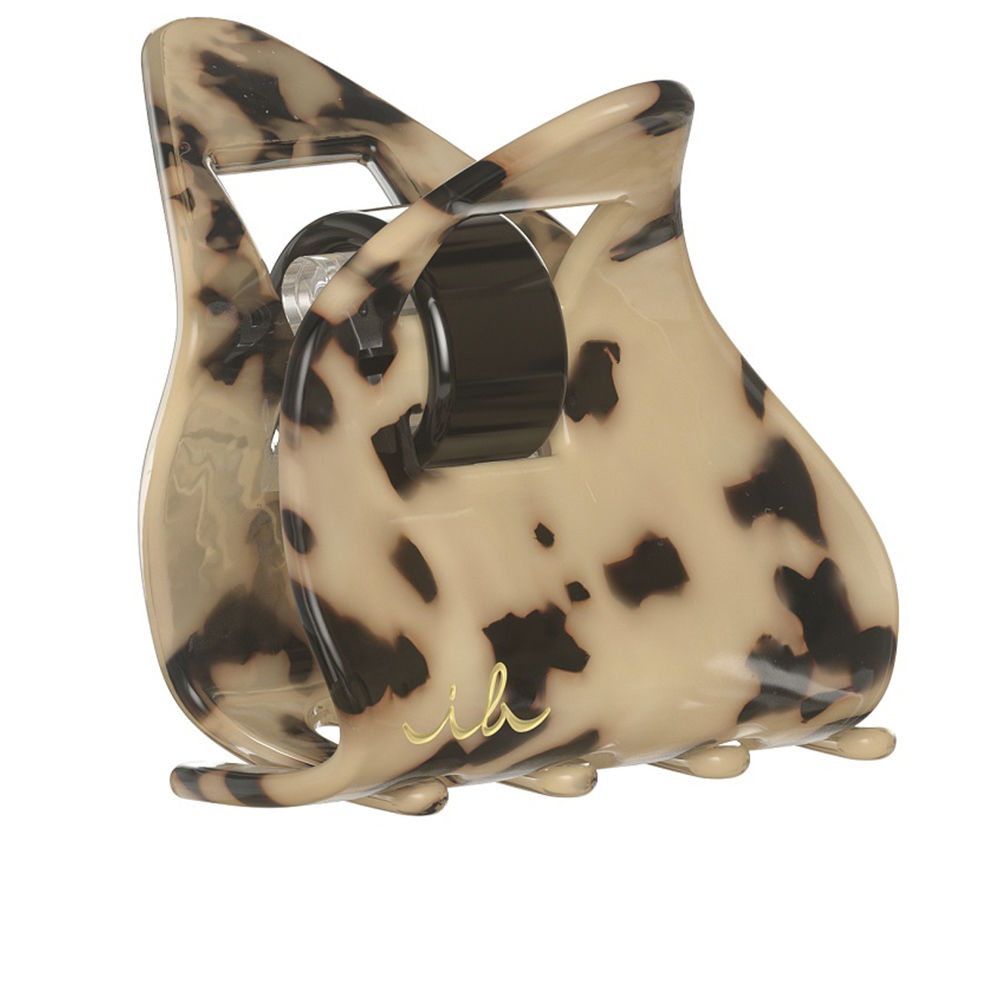 InvisibobbleEverclawLeoLove Product container of Invisibobble Everclaw Leo Love by Invisibobble, a hair claw indicated for creating an elegant and strong hold style.