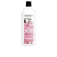 Bottle  of  Redken  Shades  Eq  Gloss  Color  000  Crystal  Clear  by  Redken,  a  liquid  color  indicated  for  adding  shine  to  hair.