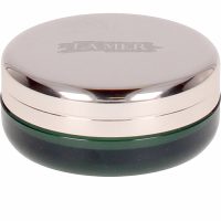 Product  container  of  La  Mer  The  Lip  Balm  by  La  Mer,  a  velvety  balm  indicated  for  smoothing  and  softening  dry  lips.
