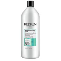 Bottle  of  Redken  Acidic  Bonding  Curls  Conditioner  by  Redken,  a  fortifying  conditioner  indicated  for  damaged  curls  and  coils.