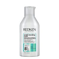 Bottle  of  Redken  Acidic  Bonding  Curls  Conditioner  by  Redken,  a  fortifying  conditioner  indicated  for  damaged  curls  and  coils.