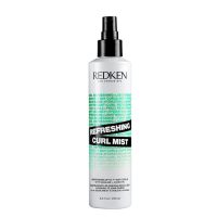 Spray  of  Redken  Refreshing  Curl  Mist  by  Redken,  a  leave-in  spray  indicated  for  refreshing  and  defining  frizzy  curls.