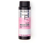 Box  of  Redken  Shades  EQ  Gloss  Bonder  Inside  Color  09T  Chrome,  a  liquid  toner  indicated  for  strengthening  sensitized  hair.