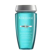 Bottle  of  Kérastase  Spécifique  Bain  Vital  Dermo-calm  Soothing  Shampoo  by  Kérastase,  a  shampoo  indicated  for  sensitive  scalp.