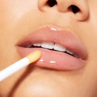 a liquid oil indicated for nourishing and repairing chapped lips.
