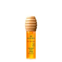 Bottle  of  Nuxe  Rêve  de  Miel  Honey  Lip  Care  by  Nuxe,  a  liquid  oil  indicated  for  nourishing  and  repairing  chapped  lips.