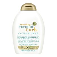 Bottle  of  Ogx  Coconut  Curls  Hair  Conditioner  by  Ogx,  a  creamy  conditioner  indicated  for  hydrating  curly  hair.