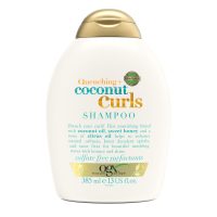 Bottle  of  Ogx  Coconut  Curls  Hair  Shampoo  by  Ogx,  a  creamy  shampoo  indicated  for  detangling  and  defining  curls.