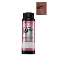 Box  of  Redken  Shades  EQ  Bonder  Inside  Color  06NB,  a  liquid  toner  indicated  for  strengthening  and  toning  sensitized  hair.
