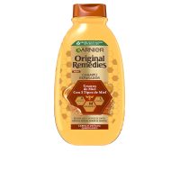 Bottle  of  Garnier  Original  Remedies  Honey  Treasures  Shampoo  by  Garnier,  a  shampoo  indicated  for  repairing  damaged  hair.