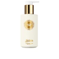 Bottle  of  Jean  Paul  Gaultier  Divine  Body  Lotion  by  Jean  Paul  Gaultier,  a  perfumed  lotion  indicated  for  skin  nourishment.