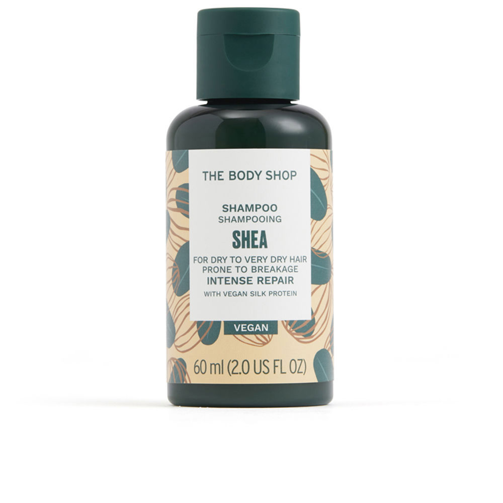 TheBodyShopSheaShampoo60ml Bottle of The Body Shop Shea Shampoo by The Body Shop, a repairing shampoo indicated for dry hair prone to breakage.